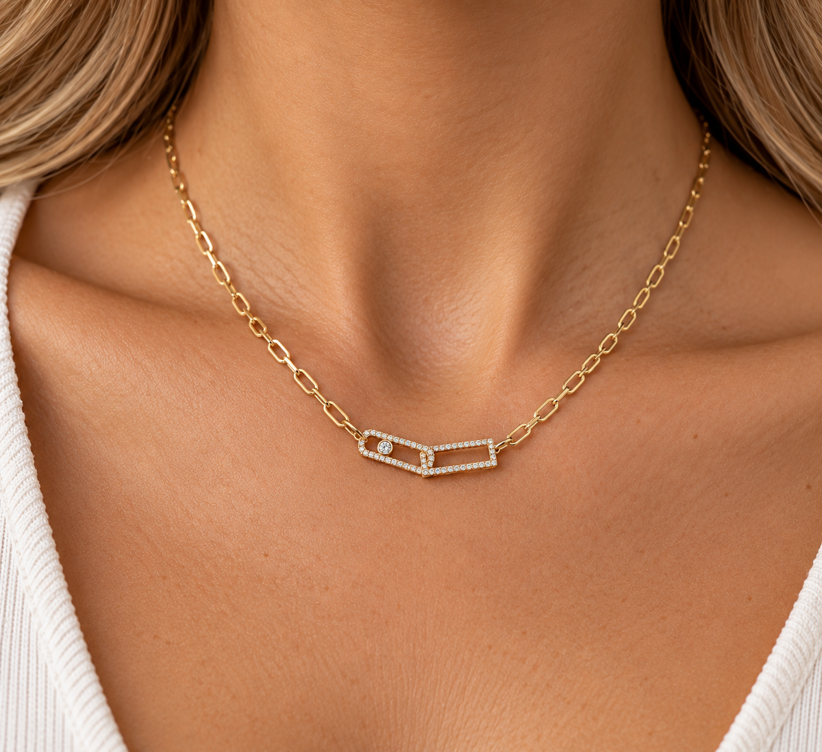 Golden Connections Diamond NecklaceModern elegance meets timeless sparkle in our Golden Connections Diamond Necklace. Featuring two beautifully intertwined geometric links accented with shimmering diamonds, this delicate necklace symbolizes connection.